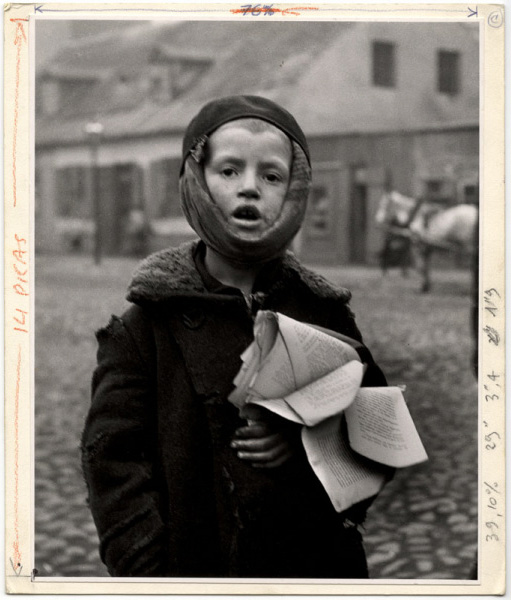 Roman Vishniac. 'A Boy with a toothache. Next year another child will inherit the tattered schoolbook. Slonim' ca 1935-38