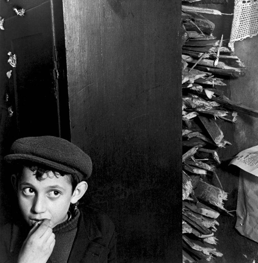 Roman Vishniac (1897-1990) 'Boy with kindling in a basement dwelling, Krochmalna Street, Warsaw' c. 1935-38