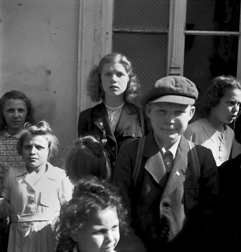 Roman Vishniac (1897-1990) 'Children waiting outside the registration office of a transit bureau' 1947