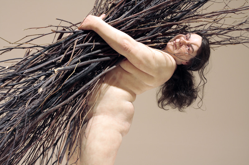 Ron Mueck (Australian, b. 1958) 'Woman with Sticks' 2008 (installation view)