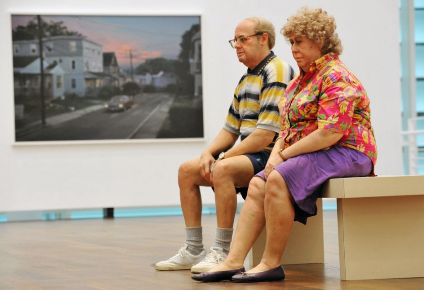 Installation photograph of the exhibition 'Duane Hanson/Gregory Crewdson: Uncanny realities' at Museum Frieder Burda with Duane Hanson 'Old Couple on a Bench' (1994) in the foreground and Gregory Crewdson 'Untitled (Worthington Street)' (2006) in the background
