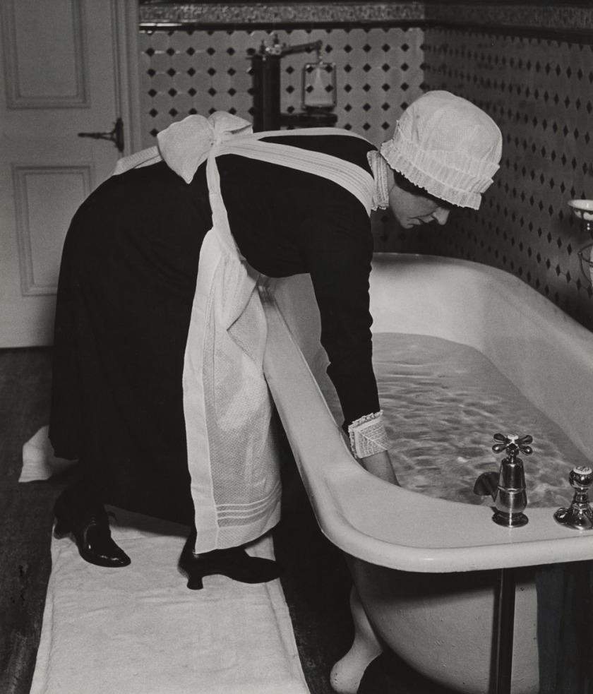 Bill Brandt (British, born Germany. 1904-1983) 'Parlourmaid Preparing a Bath before Dinner' c. 1936