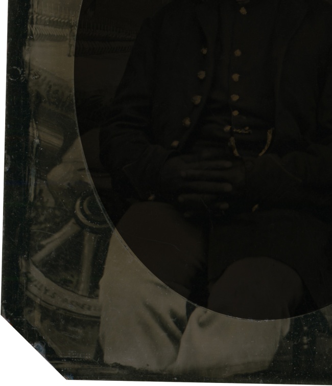 Unknown photographer. 'Private Abraham F. Brown' (inverted with overmat to show background extraneous to portrait - detail of writing on wheel) 1863
