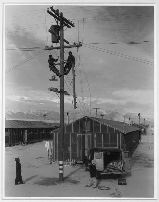 Ansel Adams (American, 1902-1984) 'Line crew at work in Manzanar, Manzanar Relocation Center' 1943