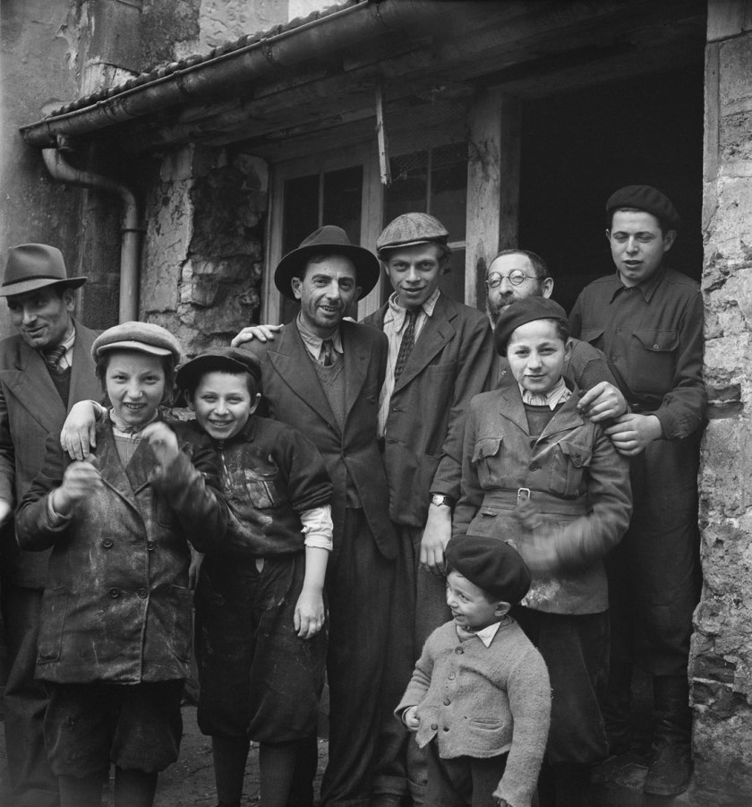 Roman Vishniac. '[Holocaust survivors gathering outside a building where matzoh is being made in preparation for the Passover holiday, Hénonville Displaced Persons' Camp, Picardy, France]' 1947