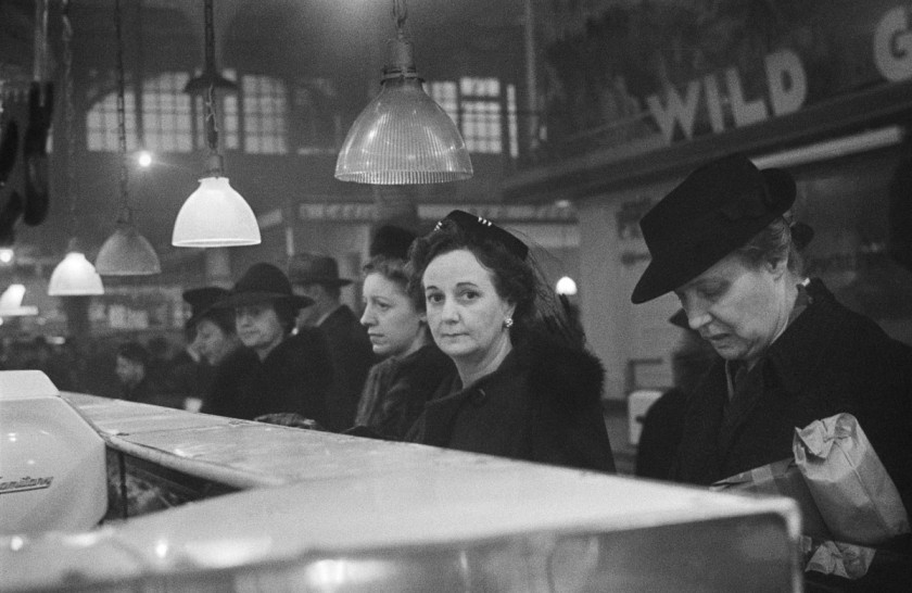 Roman Vishniac. '[Customers waiting in line at a butcher's counter during wartime rationing, Washington Market, New York]' 1941-44