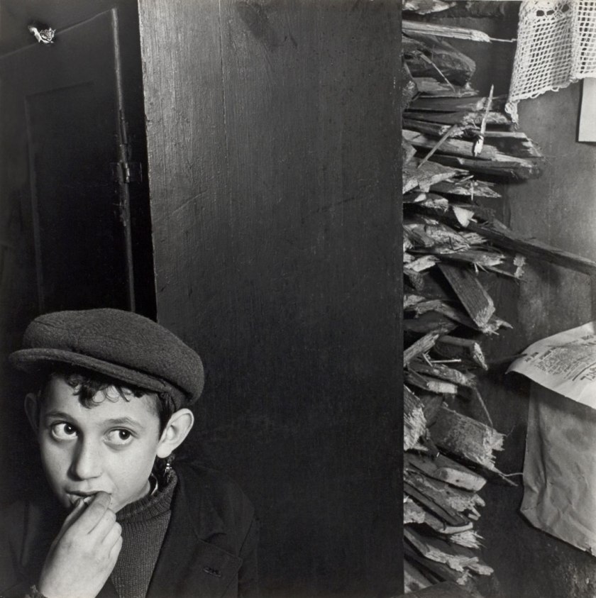 Roman Vishniac. '[Boy with kindling in a basement dwelling, Krochmalna Street, Warsaw]' c. 1935-38