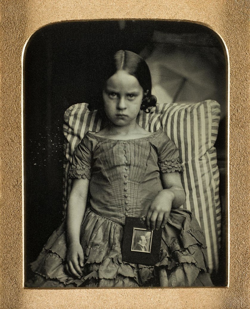 Ross and Thomson of Edinburgh. 'Unknown little girl sitting on a striped cushion holding a framed portrait of a man, possibly her dead father' 1847-60