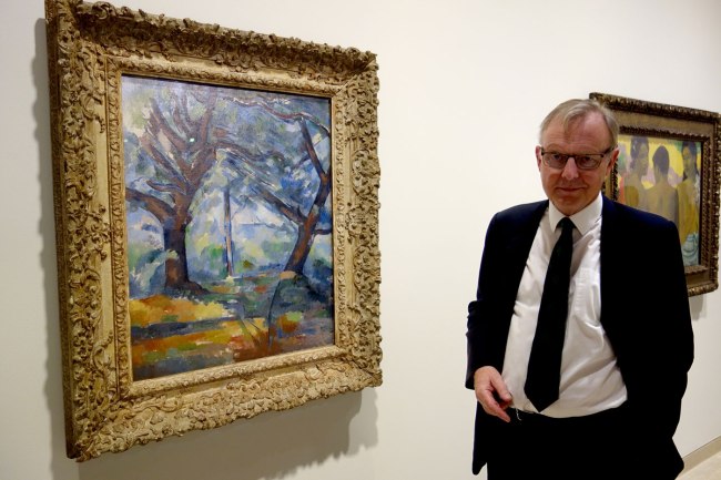 Michael Clarke, Director of the National Galleries of Scotland, with Paul Cézanne's 'The big trees' c. 1904
