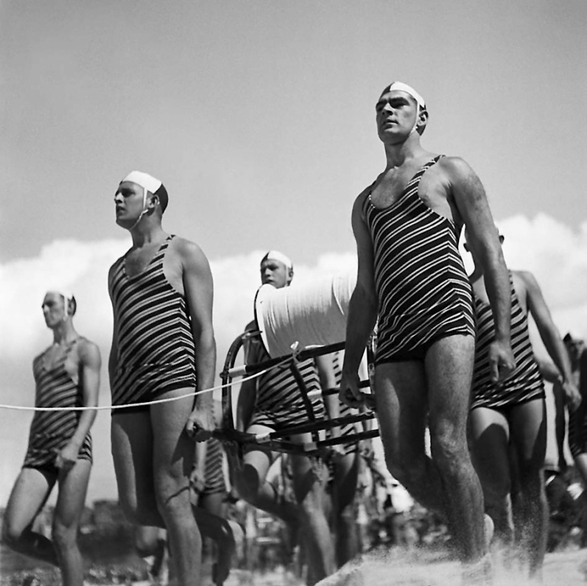 George Caddy (1914-1983) 'Freshwater Surf Life Saving Club reel team march past, 3 April 1938' 1938