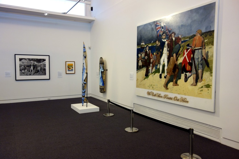 Installation view of the exhibition 'On the beach' at the Mornington Peninsula Regional Art Gallery with Daniel Boyd's 'We call them pirates out here' (2006)