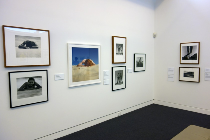 Installation view of the exhibition 'On the beach' at the Mornington Peninsula Regional Art Gallery showing at far left, Max Dupain's 'Sunbaker' (1937, top) with Diane Jones 'Sunbaker' (2003, below); in the centre Anne Zahalka's 'The sunbather #2' (1989); then Max Dupain's 'Form at Bondi' (1939, top) with Diane Jones 'Bondi' (2003) underneath