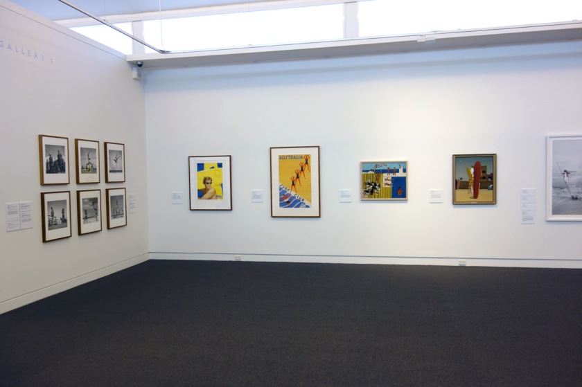 Installation view of the exhibition 'On the beach' at the Mornington Peninsula Regional Art Gallery showing at far left, George Caddy's beachobatic photographs, and on the far wall Sidney Nolan's 'Bathers' (1943) and Jeffrey Smart's 'Surfers Bondi' (1963)
