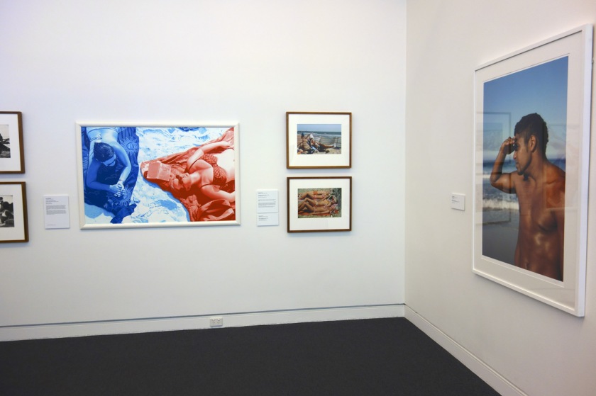 Installation view of the exhibition 'On the beach' at the Mornington Peninsula Regional Art Gallery showing on the wall right hand side, photographs by Rennie Ellis; and at right, Fiona Foley's 'Nulla 4 eva IV' (2009)