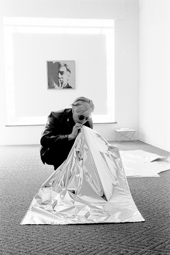 Steve Schapiro (American, 1934-2022) 'Andy Warhol Blowing Up Silver Cloud Pillow, Los Angeles' 1966