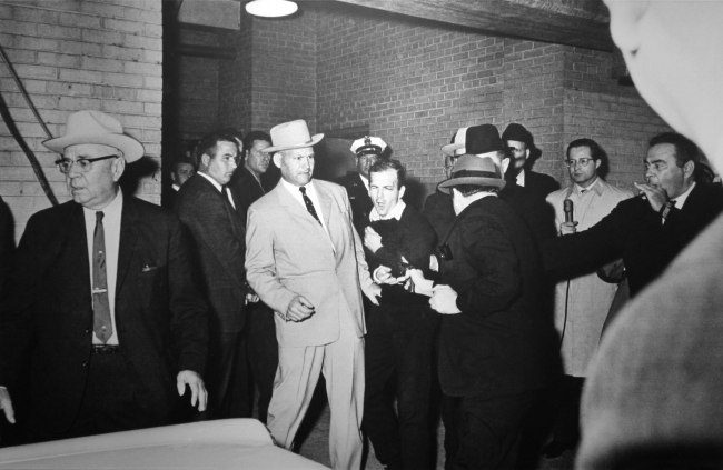 Robert H. Jackson (American, born 1934) 'FATAL BULLET HITS OSWALD. Jack Ruby fires bullet point blank into the body of Lee Harvey Oswald at Dallas Police Station. Oswald grimaces in agony' November 24, 1963