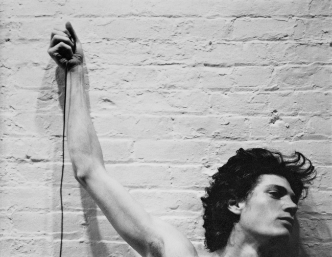Robert Mapplethorpe (American, 1946-1989) 'Self-portrait of Robert Mapplethorpe with trip cable in hand' 1974 