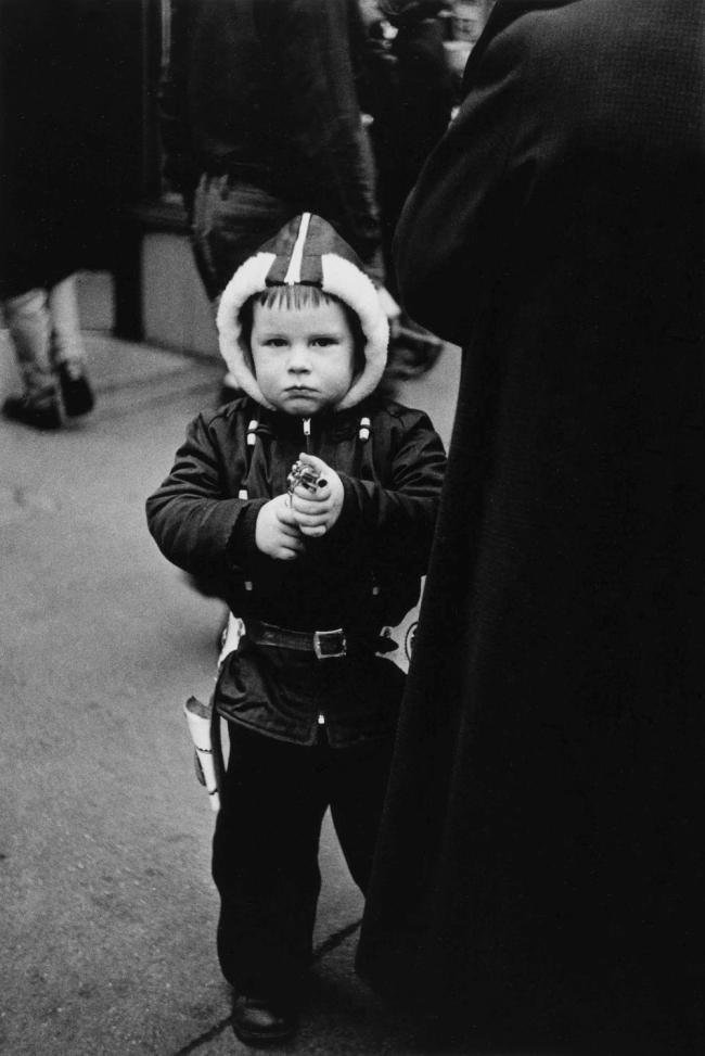 Diane Arbus (American, 1923-1971) 'Kid in a hooded jacket aiming a gun, N.Y.C., 1957' 1957