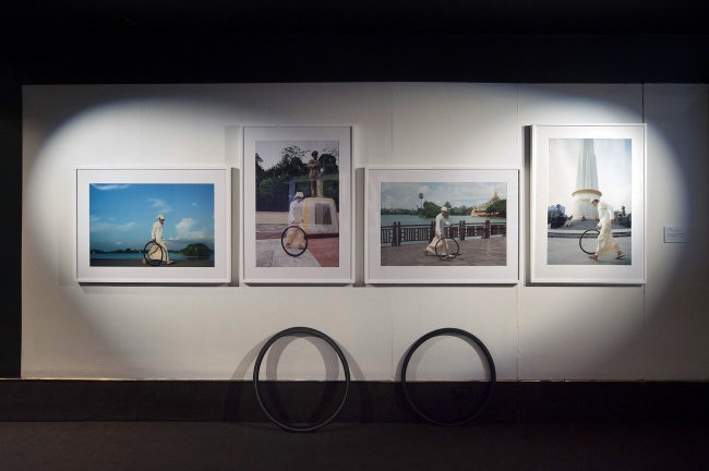 Installation view of Moe Satt's 'The Bicycle-Tyre-Rolling Event from Yangon' (2013)