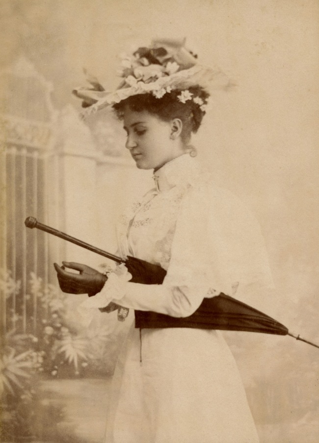 Dana Studio. 'Lady wearing gloves with parasol' 1897-1898