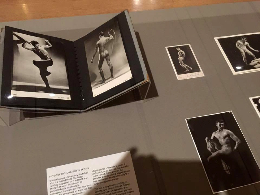 Installation view of physique album pages from Room 8 of the exhibition 'Queer British Art' at Tate Britain