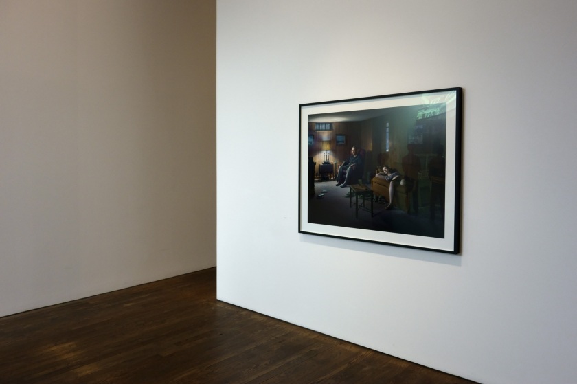 Installation view of Room 1 of 'Gregory Crewdson: Cathedral of the Pines' at The Photographers' Gallery showing 'The Basement' (2014)