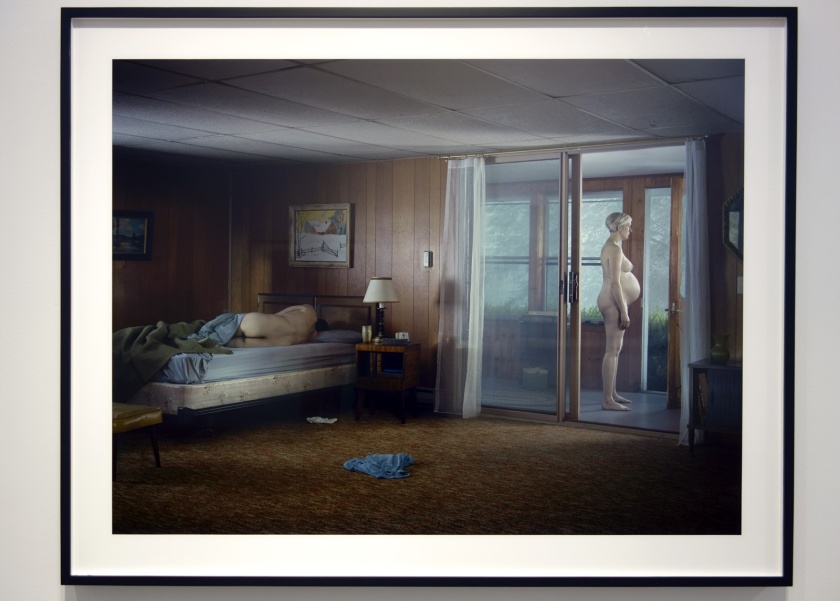 Installation view of Room 2 of 'Gregory Crewdson: Cathedral of the Pines' at The Photographers' Gallery showing 'Pregnant Woman on Porch' 2013