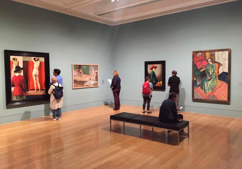Installation view of Room 5 of the exhibition 'Queer British Art' at Tate Britain featuring at left, Laura Knight's 'Self-portrait' 1913; second right, William Strang's 'Lady with a Red Hat' 1918, and at right Alvaro Guevara's 'Dame Edith Sitwell' 1916