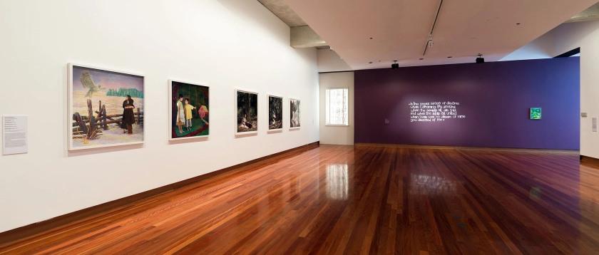 Installation view of the exhibition 'All the better to see you with: Fairy tales transformed' at The Ian Potter Museum of Art, Melbourne showing Polixeni Papapetrou's work at left and Kate Daw's work at centre right