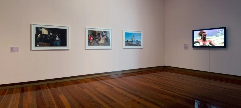 Installation view of the exhibition 'All the better to see you with: Fairy tales transformed' at The Ian Potter Museum of Art, Melbourne showing the work of Dina Goldstein at left, and the video 'Untitled (scream)' by Janaina Tschäpe at right