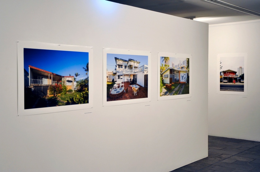 Installation view of the exhibition 'John Gollings: The history of the built world' at the Monash Gallery of Art showing at left 'Mid-century house, Surfers Paradise, Queensland' 2017; middle, 'Mid-century house, Surfers Paradise, Queensland' 2017; and right, 'Mid-century house, Surfers Paradise, Queensland' 2017