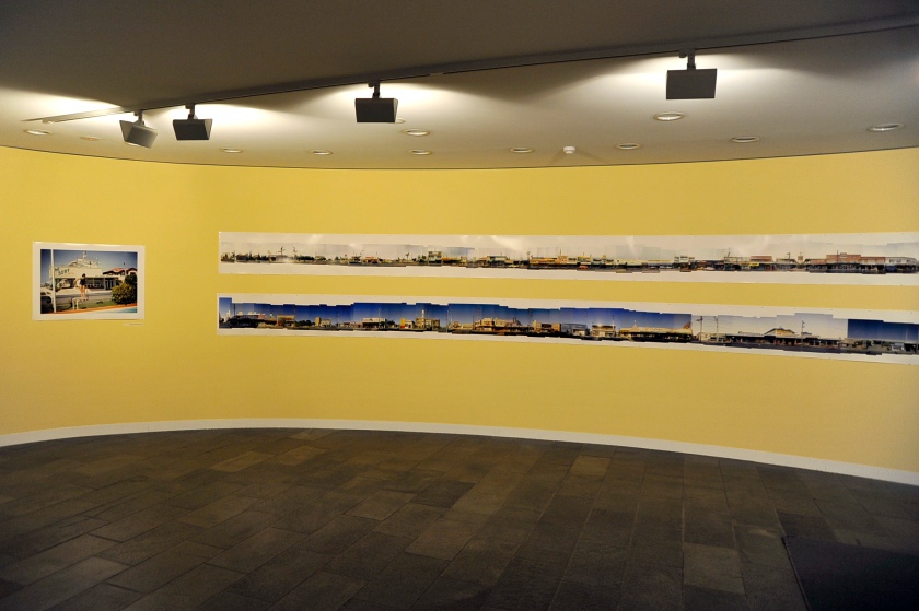 Installation view of the exhibition 'John Gollings: The history of the built world' at the Monash Gallery of Art showing at right Gollings' 'Every building on Surfers Paradise Boulevard west' 1973