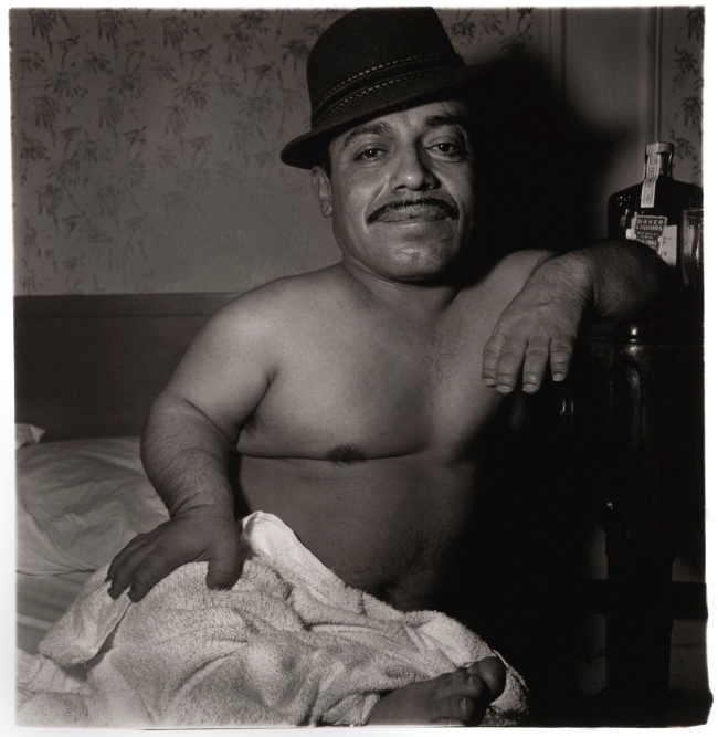 Diane Arbus (American, 1923-1971) 'Mexican dwarf in his hotel room N.Y.C. 1970' 1970