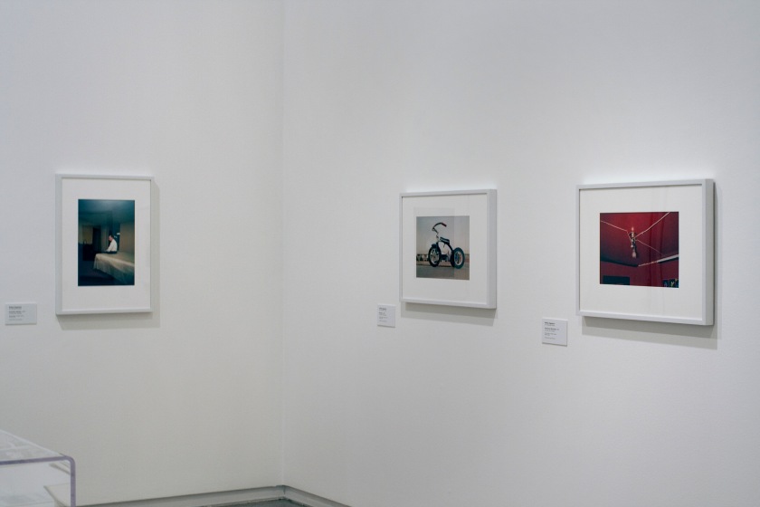 Installation view of the exhibition 'Diane Arbus: American Portraits' at the Heide Museum of Modern Art, Melbourne showing from left to right, William Eggleston's 'Huntsville, Alabama' c. 1971; William Eggleston's 'Memphis' c. 1969; and William Eggleston's 'Greenwood, Mississippi "The Red Ceiling"' 1973
