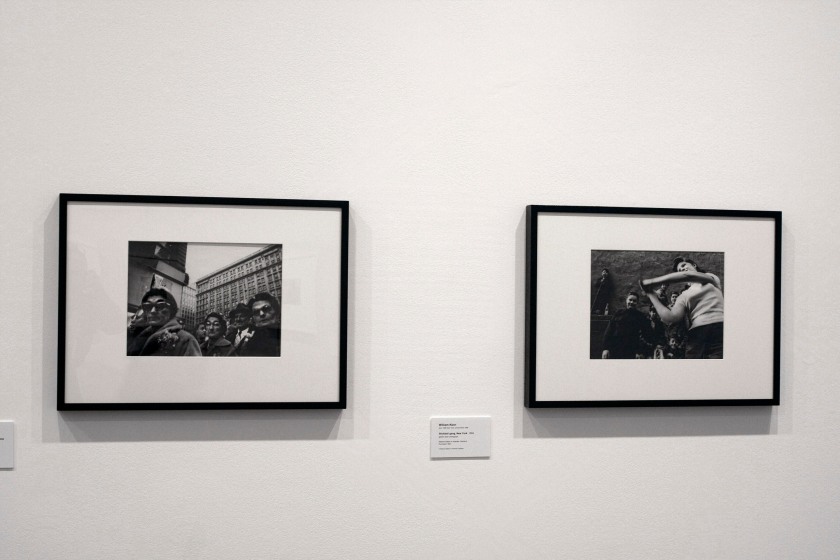 Installation view of the exhibition 'Diane Arbus: American Portraits' at the Heide Museum of Modern Art, Melbourne showing at left, William Klein's 'Christmas shoppers, near Macy's, New York' 1954; and at right, William Klein's 'Stickball gang, New York' 1955