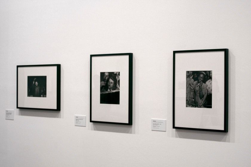 Installation view of the exhibition 'Diane Arbus: American Portraits' at the Heide Museum of Modern Art, Melbourne showing from right to left, Weegee's 'No title (at a concert in Harlem)' c. 1948, followed by his 'No title (listening to Frank Sinatra, Palace theatre)' c. 1944 and 'Emmett Kelly, Ringling Brothers and Barnum & Bailey Circus' 1943