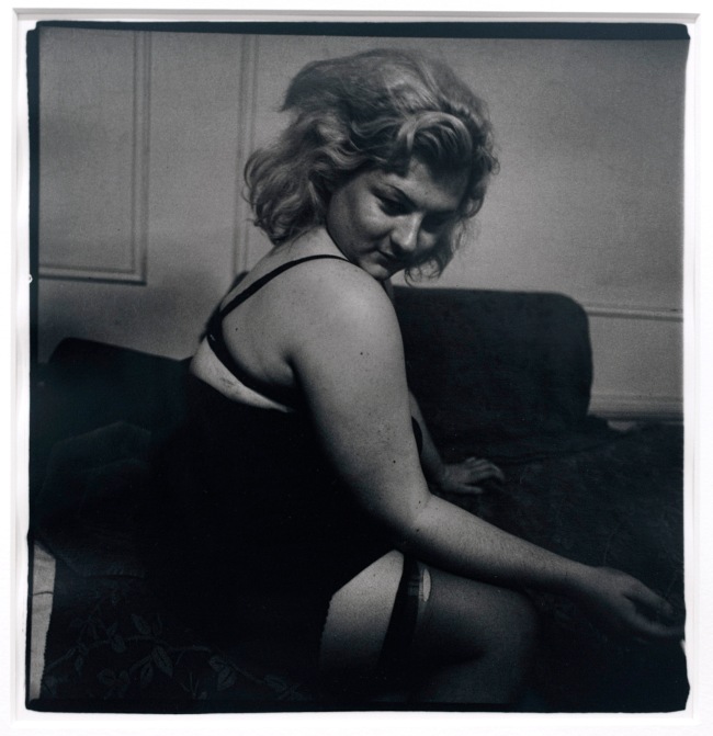 Diane Arbus (American, 1923-1971) 'Transvestite with torn stocking, N.Y.C. 1966' 1966 (installation view)