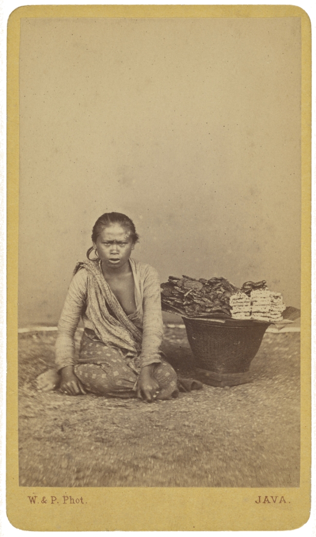 Woodbury & Page (British, active 1857-1908) '[Javanese woman seated with legs crossed, basket at side]' c. 1870