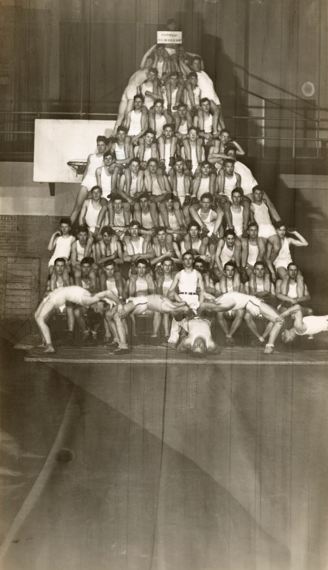 Photographer Unidentified (American) 'Untitled (human pyramid: fifty-six boys in white uniforms arranged in eight levels in a gymnasium)' 20th century