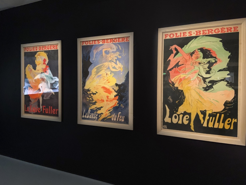 Installation view showing Jules Cheret Folies Bergere La Loie Fuller lithographs