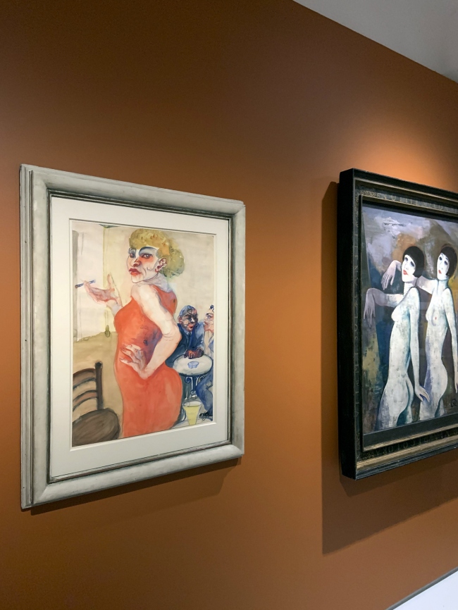 Installation view of the exhibition 'Into the Night: Cabarets and Clubs in Modern Art' at the Barbican Art Gallery, London showing at left, Elfriede Lohse-Wächtler's 'Lissy' (1931) and at right, Karl Hofer's 'Tiller Girls' (before 1927)