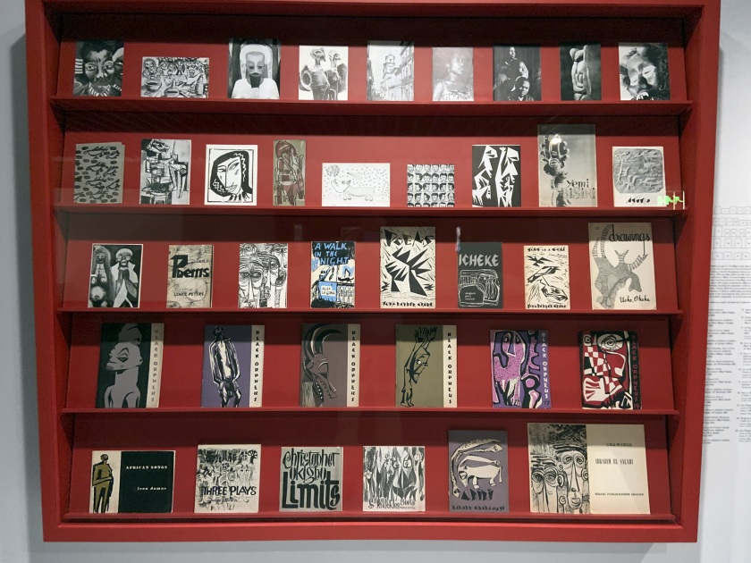 Installation view of the exhibition 'Into the Night: Cabarets and Clubs in Modern Art' at the Barbican Art Gallery showing some of the publishing output of the Mbari clubs