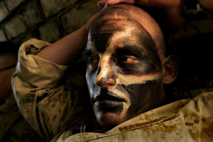 Carolyn Cole (American, b. 1961) 'A US marine is covered in camouflage face paint during the battle for Najaf, Iraq' August 2004