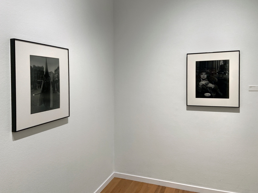 Installation view of the exhibition 'Brassaï' at Foam, Amsterdam showing photographs from the section Personages including at left, 'Festival in Seville' 1951; and at right, 'La Môme Bijou, Bar de la Lune, Montmartre' 1932