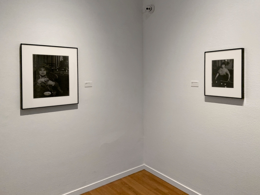 Installation view of the exhibition 'Brassaï' at Foam, Amsterdam showing photographs from the section Personages including at left 'La Môme Bijou, Bar de la Lune, Montmartre' 1932; and at right, 'Billiard Player, boulevard Rochechouart' 1932-1933