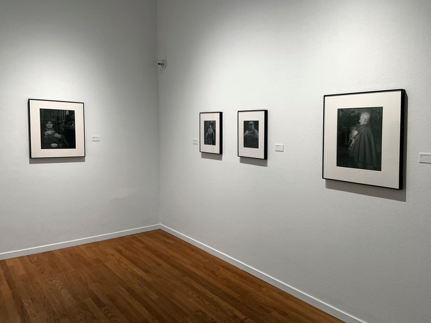 Installation view of the exhibition 'Brassaï' at Foam, Amsterdam showing photographs from the section Personages including at left 'La Môme Bijou, Bar de la Lune, Montmartre' 1932; and in the centre, 'Billiard Player, boulevard Rochechouart' 1932-1933 and 'Market Porter, Les Halles' 1939