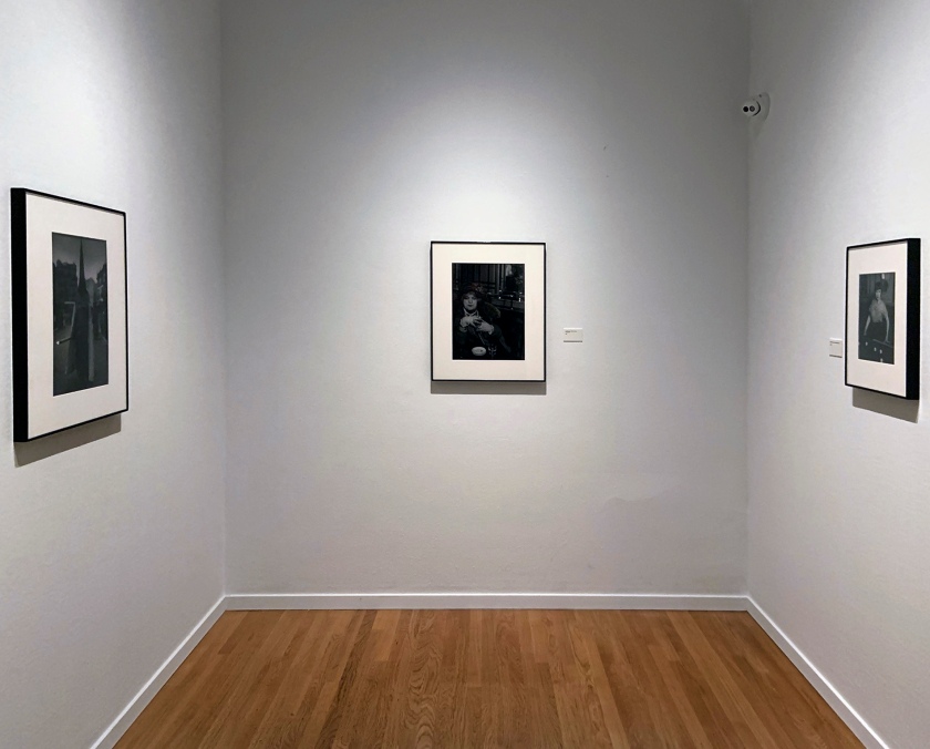 Installation view of the exhibition 'Brassaï' at Foam, Amsterdam showing photographs from the section Personages including at left, 'Festival in Seville' 1951; at centre, 'La Môme Bijou, Bar de la Lune, Montmartre' 1932; and at right, 'Billiard Player, boulevard Rochechouart' 1932-1933