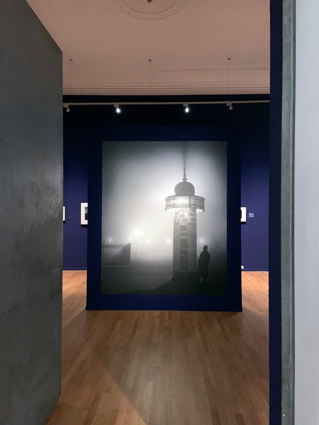 Installation view of the exhibition 'Brassaï' at Foam, Amsterdam showing a modern enlargement of Brassaï's 'Morris Column, avenue de l'Observatoire' 1934 