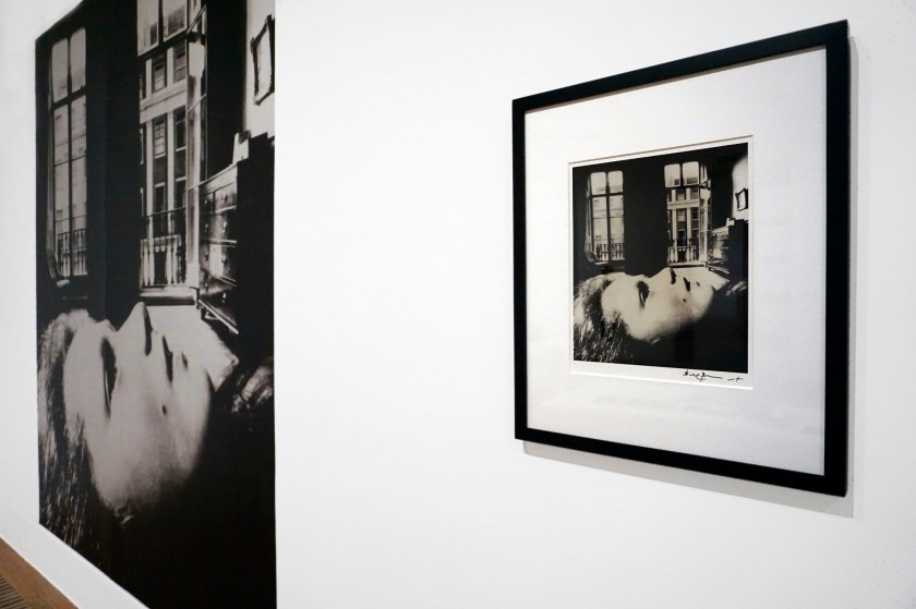 Installation view of the exhibition 'Bill Brandt: Inside the Mirror' at Tate Britain, London, October 2022 - January 2023 showing at right, Brandt's photograph 'Portrait of a Young Girl, Eaton Place' (1955) next to a modern mural enlargement