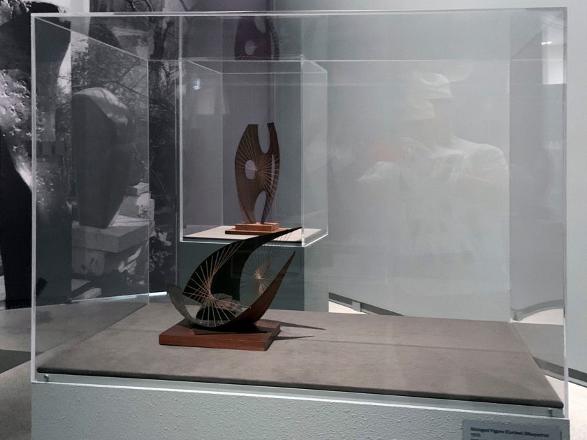 Installation view of the exhibition 'Barbara Hepworth: In Equilibrium' at the Heide Museum of Modern Art, Melbourne showing at front 'Stringed Figure (Curlew) (Maquette)' 1956; and at rear 'Maquette for Winged Figure' 1957